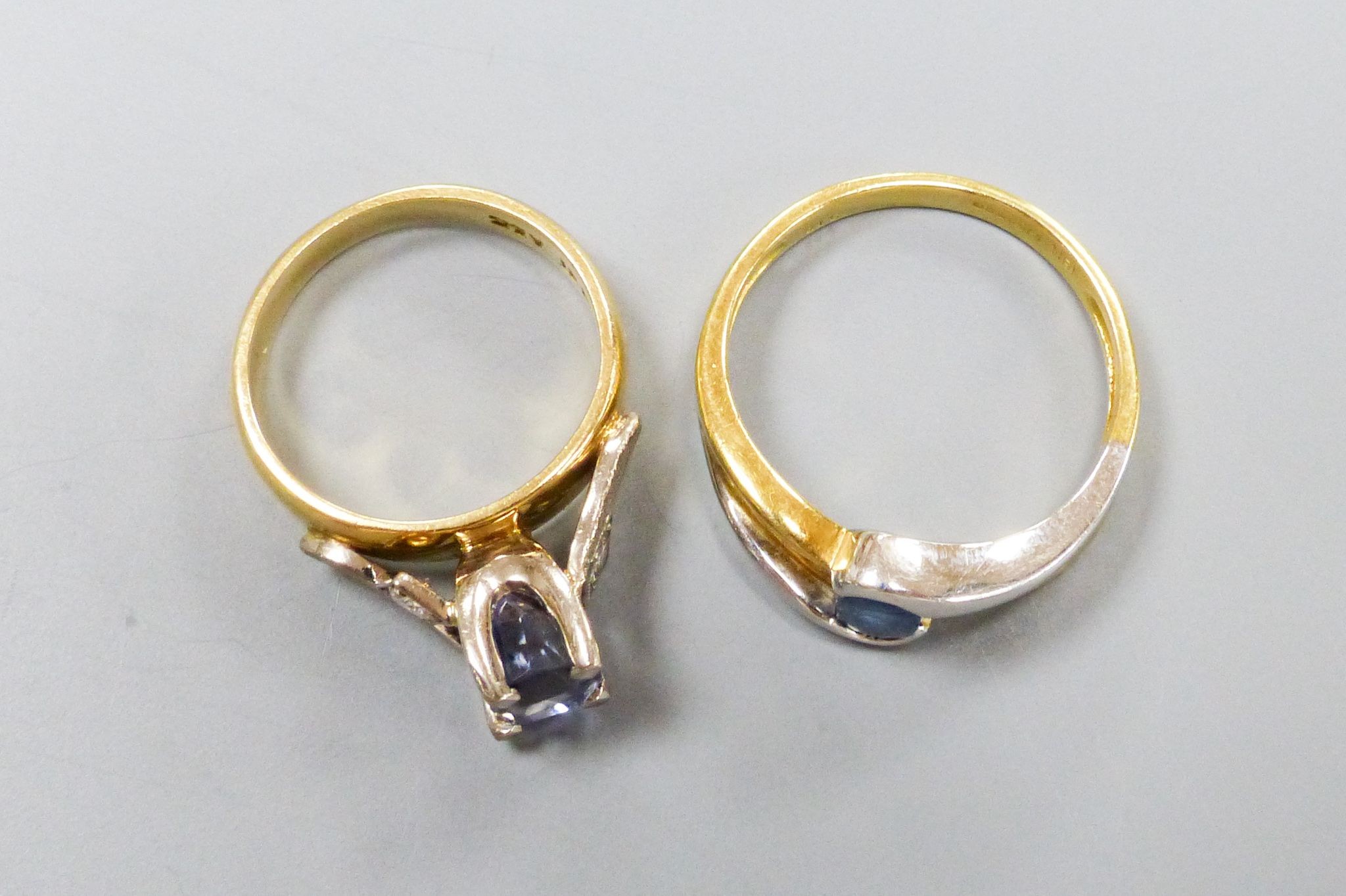 Two modern 18ct gold, sapphire and diamond set dress rings including three stone sizes I & P, gross weight 10 grams.